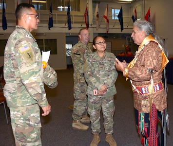 (From left) Army Maj. Michael John, U.S. Army North; Air Force Tech. Sgt. Ninanne Gutierrez, 381st Training Support Squadron; and Edwin De Luna talk about their shared Navajo (Diné) heritage after the National American Indian Heritage Month celebration at Joint Base San Antonio-Fort Sam Houston Nov. 19.