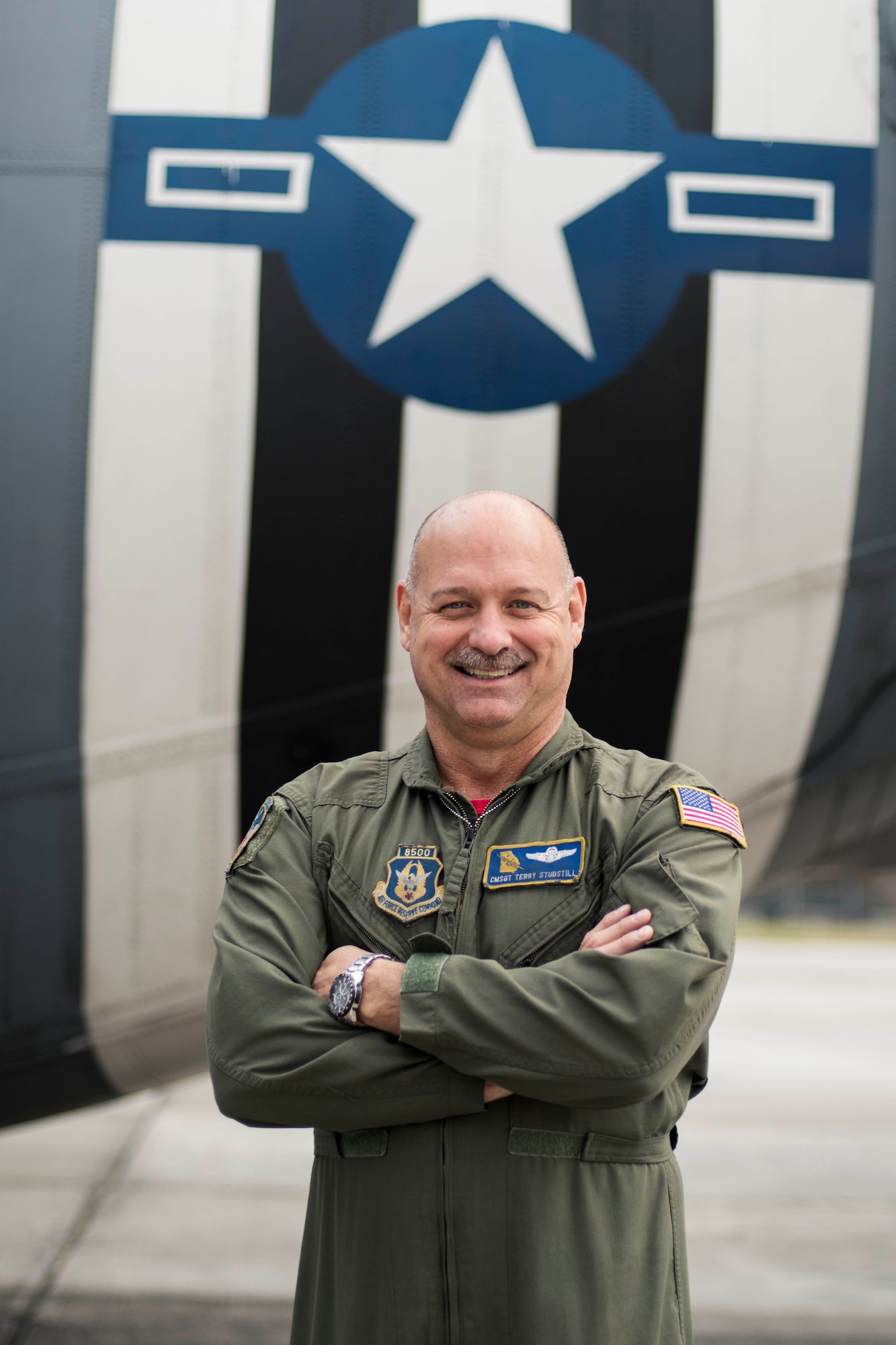 Chief Master Sgt. Terry Studstill, 700th Airlift Squadron flight engineer superintendent, poses for a photo outside a C-130H3 Hercules at Dobbins Air Reserve Base, Ga. on Nov. 22, 2019. A couple days later, he reached 10,000 flight hours - a major accomplishment for aviators. (U.S. Air Force photo/Tech. Sgt. Andrew Park)