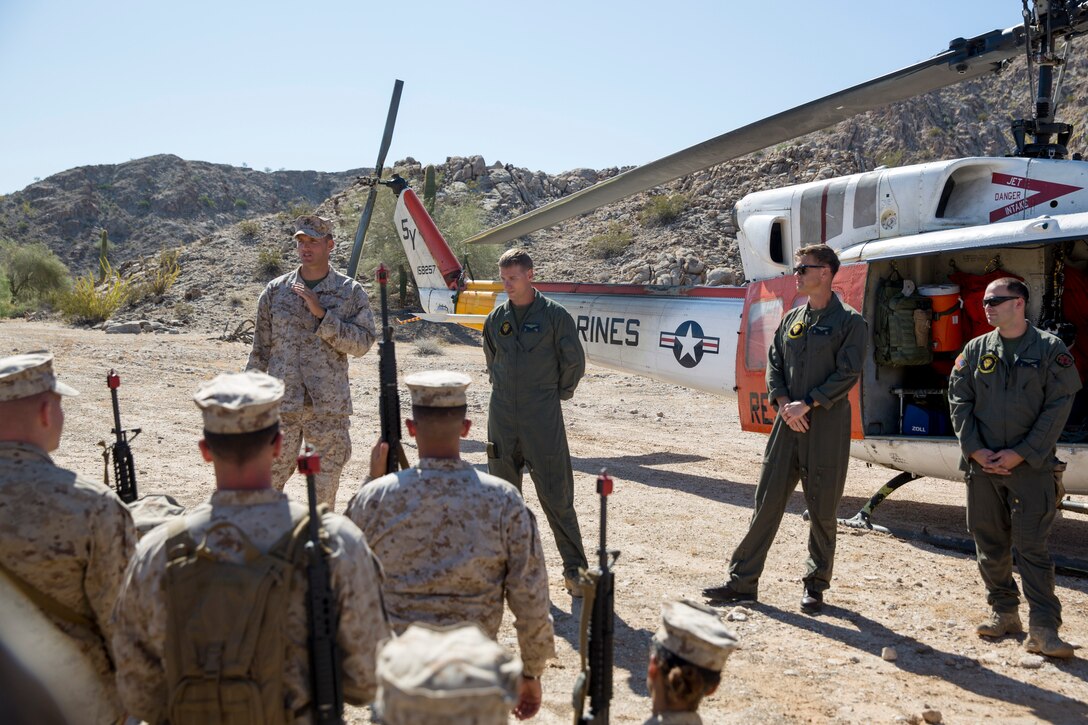 U.S. Marine Corps Lt.Col. James C. Paxton, the commanding officer of Marine Corps Air Station (MCAS) Yuma's Headquarters & Headquarters Squadron, leads non-commissioned officers (NCOs) in a hike during “Operation Backbone" in Yuma, Arizona, Oct. 25, 2019. Operation Backbone helps to strengthen the warrior spirit in NCOs and promote cohesion between the different units of MCAS Yuma. The exercise consisted of a five and a half mile hike, several classes, and closed with a warriors night dinner. Classes included simulated room clearing, a Search and Rescue (SAR) demonstration, and proper procedure when fitting a tourniquet. (U.S. Marine Corps photo by Cpl. Nicole Rogge)