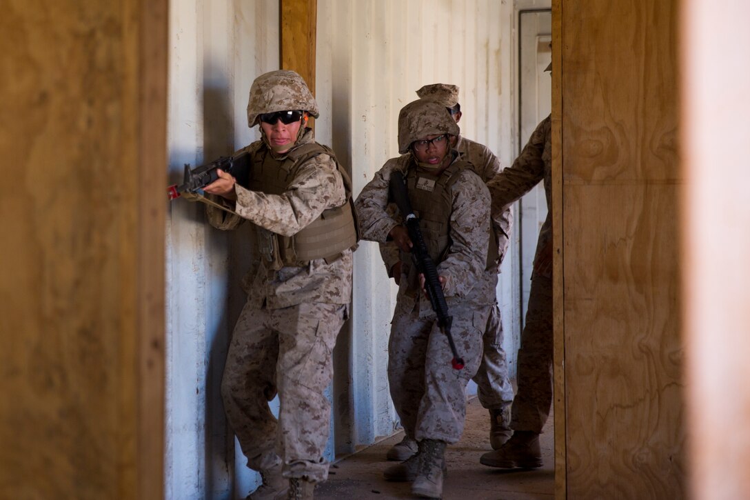 U.S. Marine Corps Lt.Col. James C. Paxton, the commanding officer of Marine Corps Air Station (MCAS) Yuma's Headquarters & Headquarters Squadron, leads non-commissioned officers (NCOs) in a hike during “Operation Backbone" in Yuma, Arizona, Oct. 25, 2019. Operation Backbone helps to strengthen the warrior spirit in NCOs and promote cohesion between the different units of MCAS Yuma. The exercise consisted of a five and a half mile hike, several classes, and closed with a warriors night dinner. Classes included simulated room clearing, a Search and Rescue (SAR) demonstration, and proper procedure when fitting a tourniquet. (U.S. Marine Corps photo by Cpl. Nicole Rogge)
