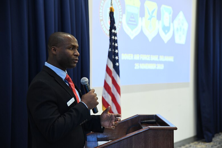Evans Armantrading, vice chair of the Central Delaware Chamber of Commerce Military Affairs Committee, introduces Col. Joel Safranek, 436th Airlift Wing commander, during the State of the Base on Dover Air Force Base, Del., Nov. 25, 2019. The CDCC Military Affairs Committee hosts the State of the Base each year to inform the community and civilian leaders of the base’s operations and economic impact. (U.S. Air Force photo by Senior Airman Eric M. Fisher)