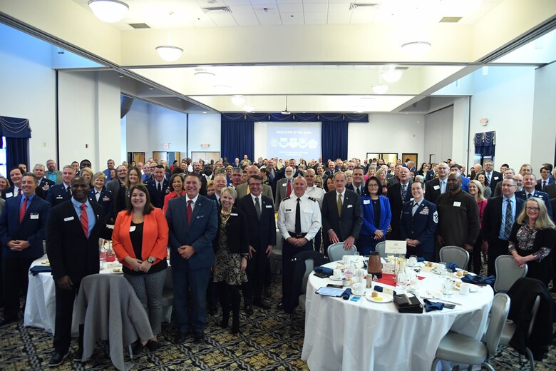State of the Base attendees pose for a photo on Dover Air Force Base, Del., Nov. 25, 2019. Many community leaders from around Delaware attended the event to gain insight into the base’s operations and plans for future improvements. (U.S. Air Force photo by Senior Airman Eric M. Fisher)