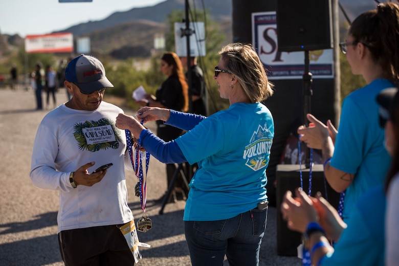 Competitors in the 2nd Annual Telegraph Pass Challenge prepare to start the 5 mile bike portion of the race in Yuma, Ariz., Nov. 2, 2019. The challenge, coordinated by Marine Corps Community Services (MCCS), offered participants the opportunity to compete for first, second, or third place in either a 5 mile run, 5 mile bike route, or both. (U.S. Marine Corps photo by Sgt. Isaac D. Martinez)