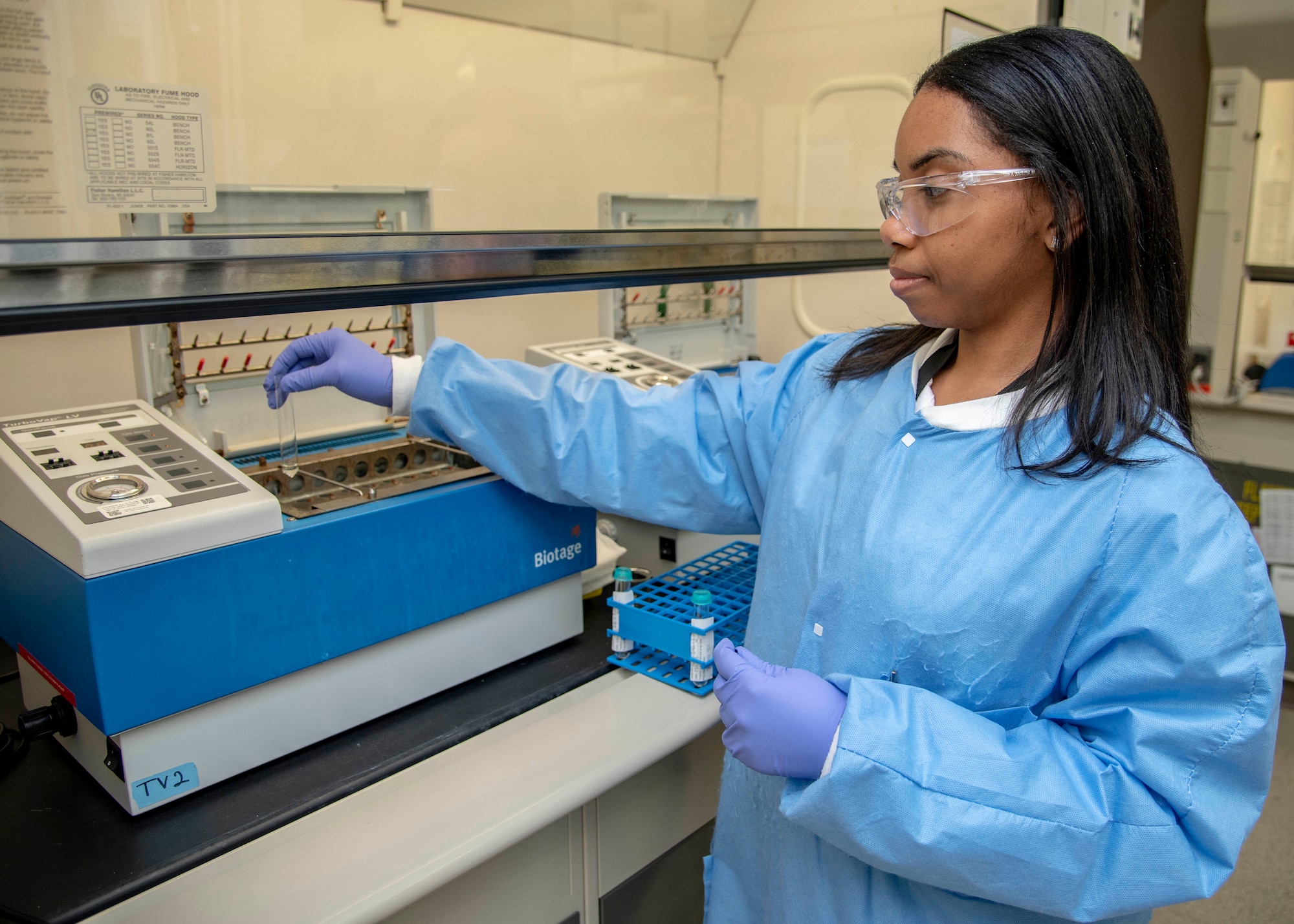 Tiara Evans, Armed Forces Medical Examiner System Forensic Toxicology analytical toxicologist 1, places a vial into a turbovap October 31, 2019 at the AFMES Forensic Toxicology lab. A turbovap dries the liquid being tested, leaving any potential drug behind. (U.S. Air Force photo by Staff Sgt. Nicole Leidholm)