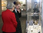 Jacqueline Davis(left), Fort Sam Houston Museum director, shows Mary Jean Eisenhower, granddaughter of President Dwight D. Eisenhower, artifacts from her grandfather's life, during her visit to the Fort Sam Houston Museum Nov. 22. During her visit, Eisenhower also toured the U.S. Army North headquarters and visited the Eisenhower quarters, still in use today. President Eisenhower was stationed at Fort Sam Houston both as a lieutenant and a colonel, and he even met his wife, Mamie, at the Army post.