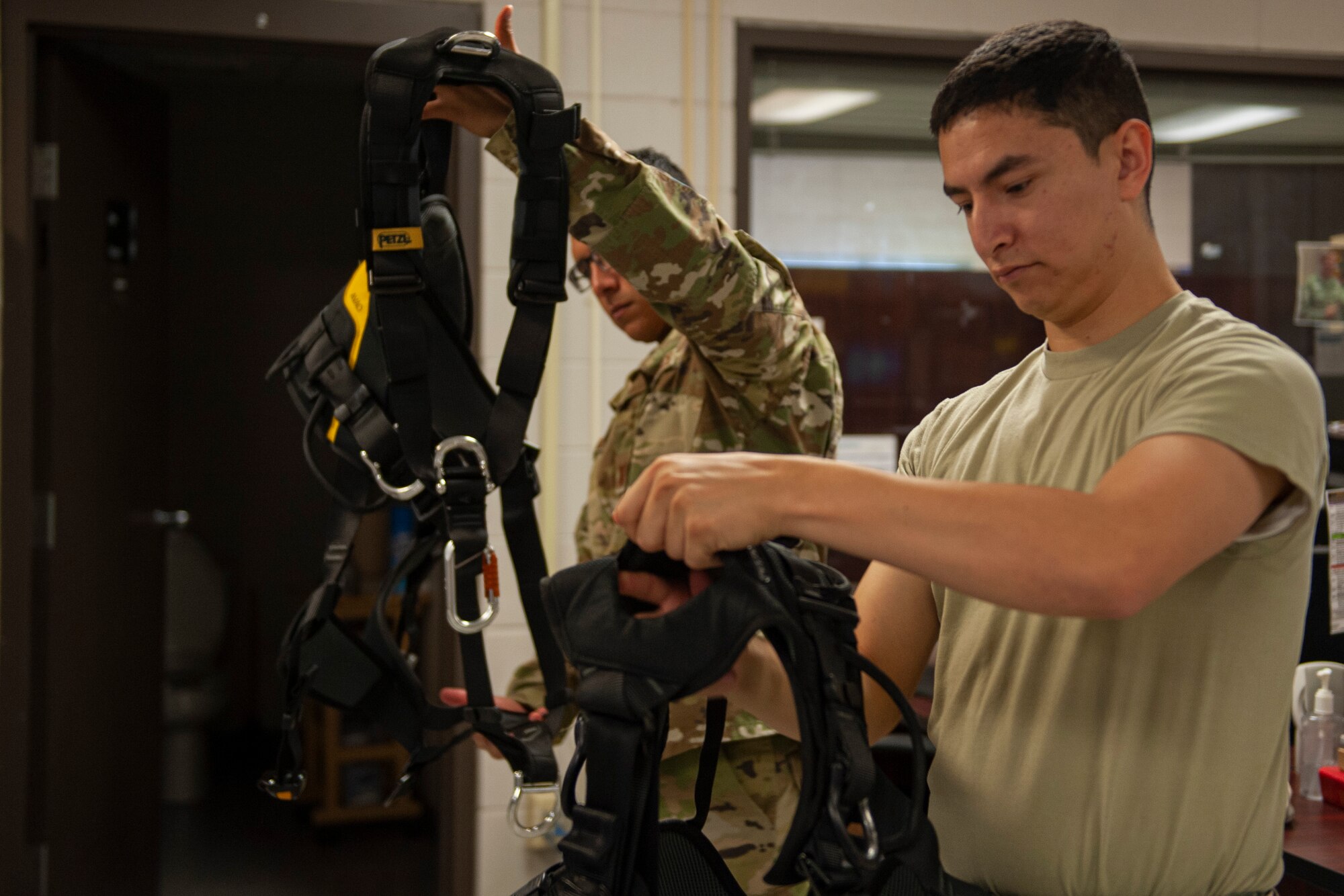 A photo of Airmen inspecting gear before training
