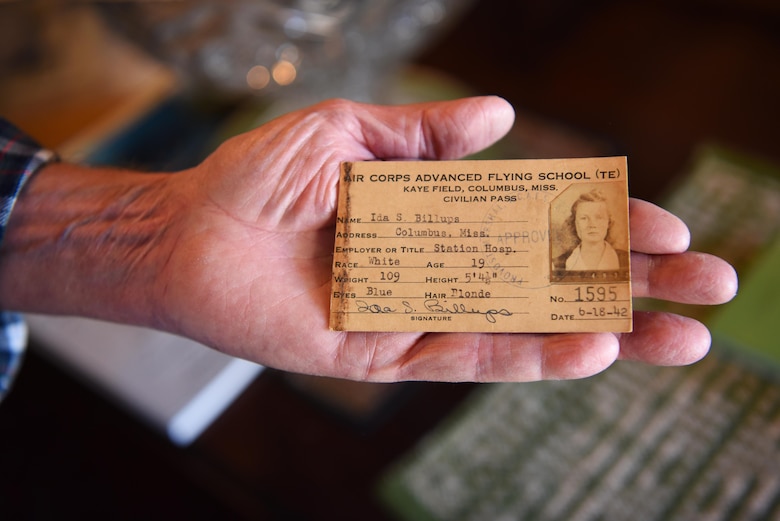 Rufus Ward, honorary commander of the 43rd Flying Training Squadron, holds up an Identification Card of his mother when she was a civilian worker on Columbus Army Air Field, Nov. 20, 2019, in Columbus, Miss. Ida Ward worked at the Kaye Army Air Field Station Hospital on Columbus Army Air Field during World War II and volunteered for the Civil Air Patrol to fly in a Piper Cub. (U.S. Air Force photo by Airmen 1st Class Jake Jacobsen)