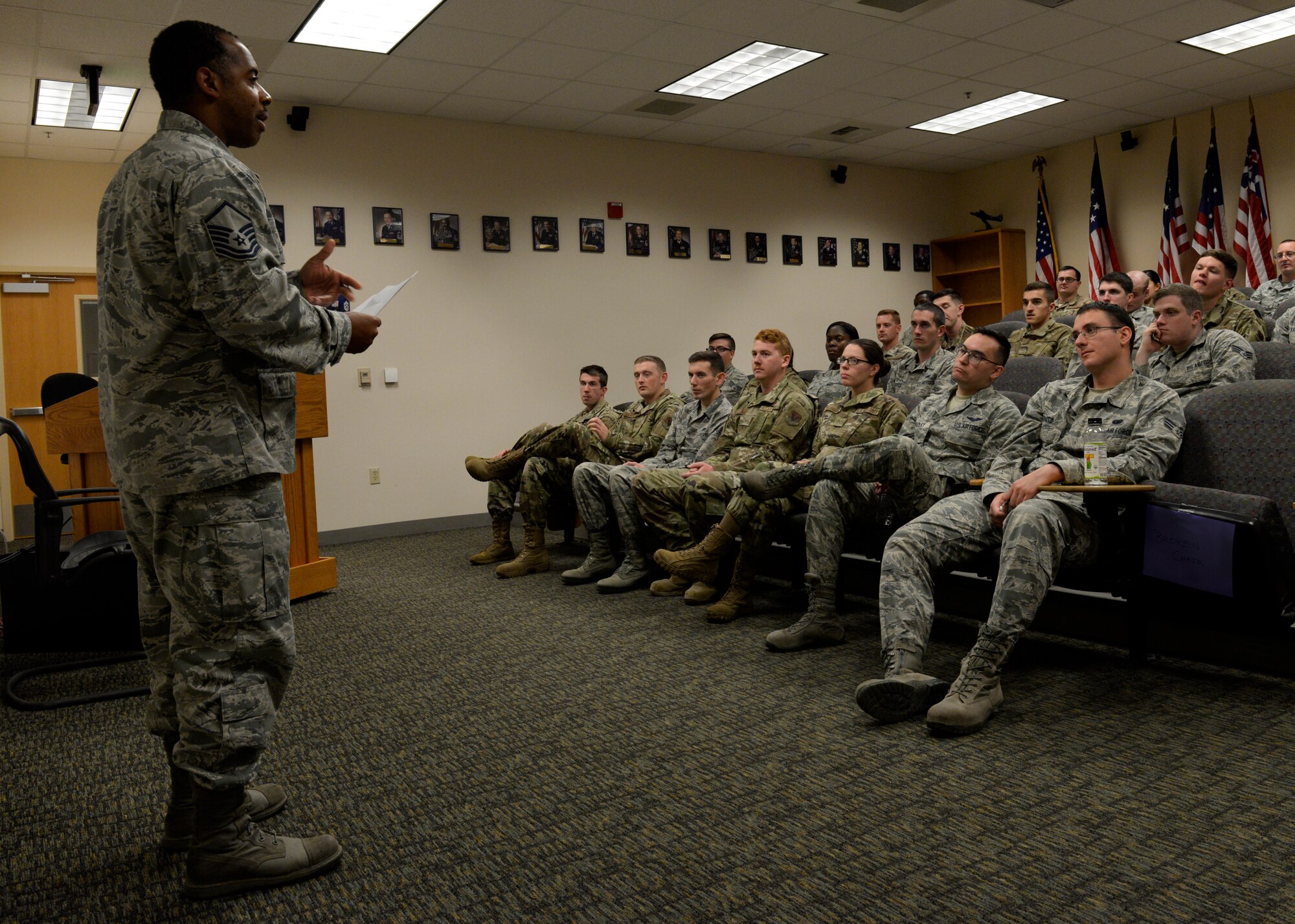 A photo of a senior non-commissioned officer addressing an Airmen Leadership School class.
