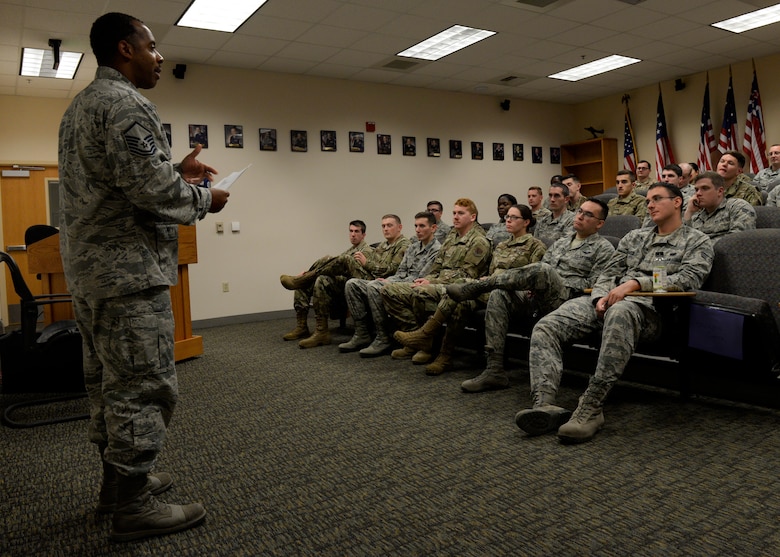 A photo of a senior non-commissioned officer addressing an Airmen Leadership School class.