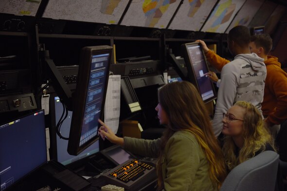 Instructor pilots, RAPCON and tower controllers from Columbus Air Force Base interacting with monitors in a training room Nov. 22, 2019, at the Memphis Center, Tenn. Columbus AFB is one of the busiest bases for Air Traffic Controllers with the average upgrade training time for Tower trainees being ten months and for RAPCON trainees is one year. (U.S. Air Force photo by Airmen 1st Class Jake Jacobsen)