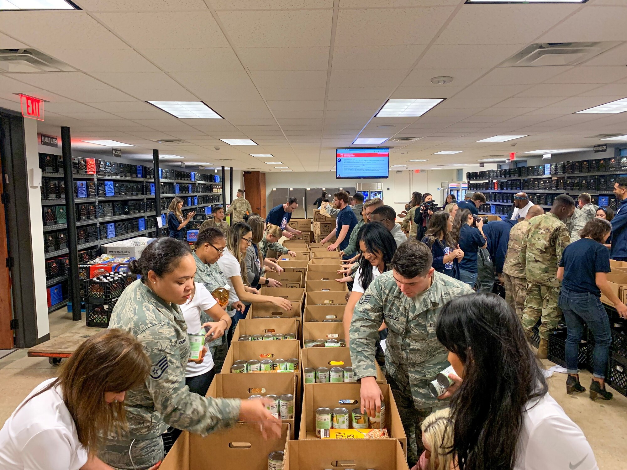 Team Fort Worth members representing the Air Force, Air National Guard, and Navy came together with the National Basketball Association’s Dallas Mavericks on November 5, 2019 to construct 500 meal packages that were slated to be distributed to local veterans in need during the holiday season. Hoops for Troops: Commitment to Service is a DoD initiative where the military and NBA teams from across the country partner together to serve their surrounding communities. (U.S. Air Force photo by Capt. Jessica Gross)