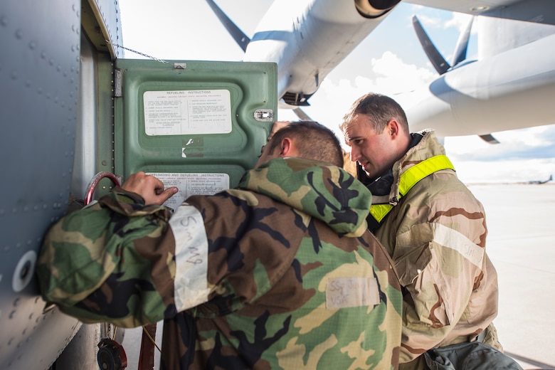 Senior Airman Mitchell Moore, 27th Special Operations Logistics Readiness Squadron fuels journeyman, and Staff Sgt. Jeremy Brada, 27th Special Operations Aircraft Maintenance Squadron dedicated crew chief, connect a fuel hose to an aircraft during an Operational Readiness Assessment at Cannon Air Force Base, N.M., Nov. 20, 2019. Twenty four hour operations were maintained during the ORA. (U.S. Air Force photo by Senior Airman Vernon R. Walter III)