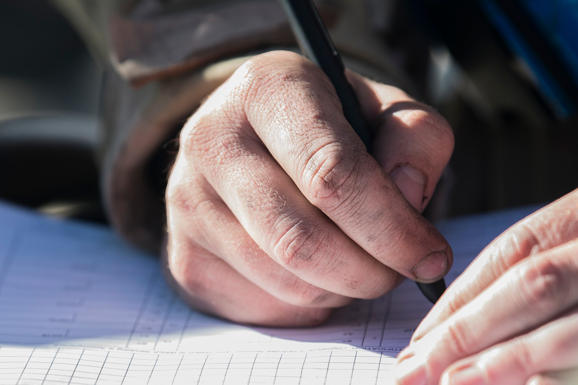 A Cannon Airman fills out paperwork on the flightline during maintenance on a CV-22 Osprey during an Operational Readiness Assessment at Cannon Air Force Base, N.M., Nov. 20, 2019. Cannon has participated in three operational readiness exercises to prepare themselves for the assessment from Air Force Special Operations Command. (U.S. Air Force photo by Senior Airman Vernon R. Walter III)