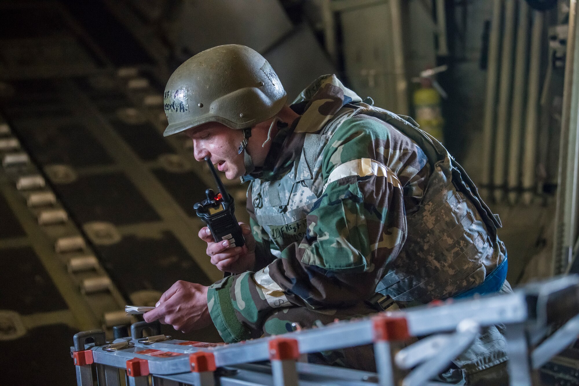 Master Sgt. Austen Martel, 27th Special Operations Aircraft Maintenance Squadron crew chief, calls in that his team has sustained injuries from a simulated sniper attack during an Operational Readiness Assessment at Cannon Air Force Base, N.M., Nov. 20, 2019. Teams were graded on their ability to perform the proper actions in response to various scenarios. (U.S. Air Force photo by Senior Airman Vernon R. Walter III)