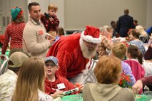 Santa Claus visits with family members during U.S. Army Space and Missile Defense Command’s Survivor Outreach Services Holiday Party at the Botanical Gardens in Huntsville, Alabama, Nov. 22. (U.S. Army photo by Jason B. Cutshaw)
