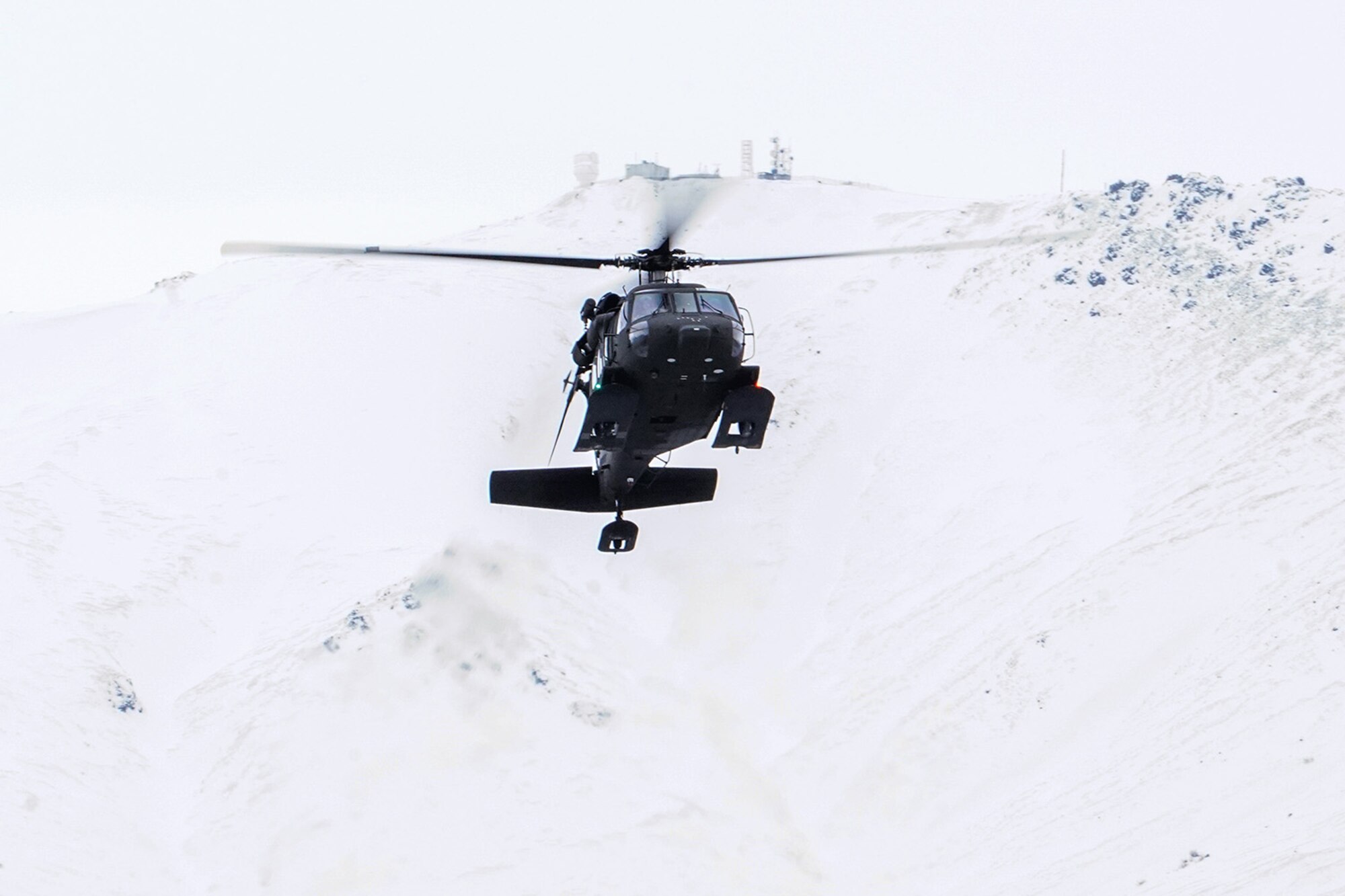 A UH-60 Black Hawk helicopter from the Alaska Army National Guard approaches Neibhur Drop Zone, Nov. 26, 2019, to assist Soldiers assigned to the 6th Brigade Engineer Battalion (Airborne), 4th Infantry Brigade Combat Team (Airborne), 25th Infantry Division, U.S. Army Alaska, in honing their life-saving and Medevac hoist skills for the paratroopers’ upcoming rotation to the Joint Readiness Training Center at Fort Polk, La.