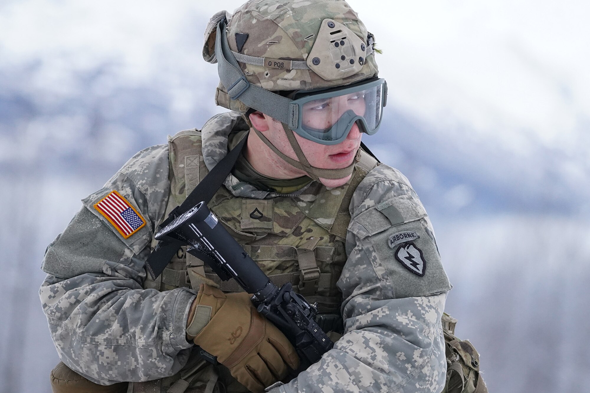 Army Pfc. Alexander Carrasco assigned to Headquarters and Headquarters Company, 6th Brigade Engineer Battalion (Airborne), 4th Infantry Brigade Combat Team (Airborne), 25th Infantry Division, U.S. Army Alaska, waits at an extraction point while training with aviators from the Alaska Army National Guard at Neibhur Drop Zone, Nov. 26, 2019, to hone their life-saving and Medevac hoist skills for the paratroopers’ upcoming rotation to the Joint Readiness Training Center at Fort Polk, La.
