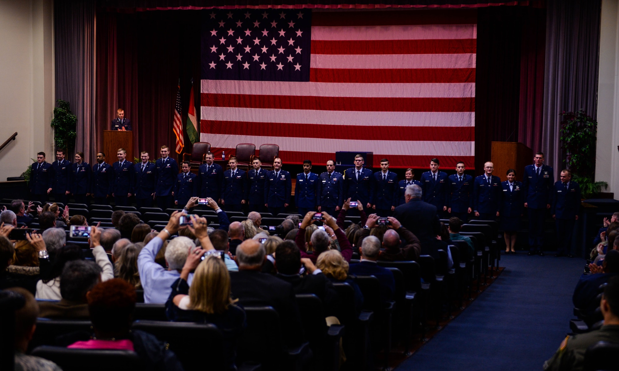 Specialized Undergraduate Pilot Training Class 20-03 are applauded by those in attendance during their graduation ceremony Nov. 15, 2019, at Columbus Air Force Base, Miss. Aviators receive their pilot “silver wings” upon graduation from pilot training. (U.S. Air Force photo by Airman Davis Donaldson)