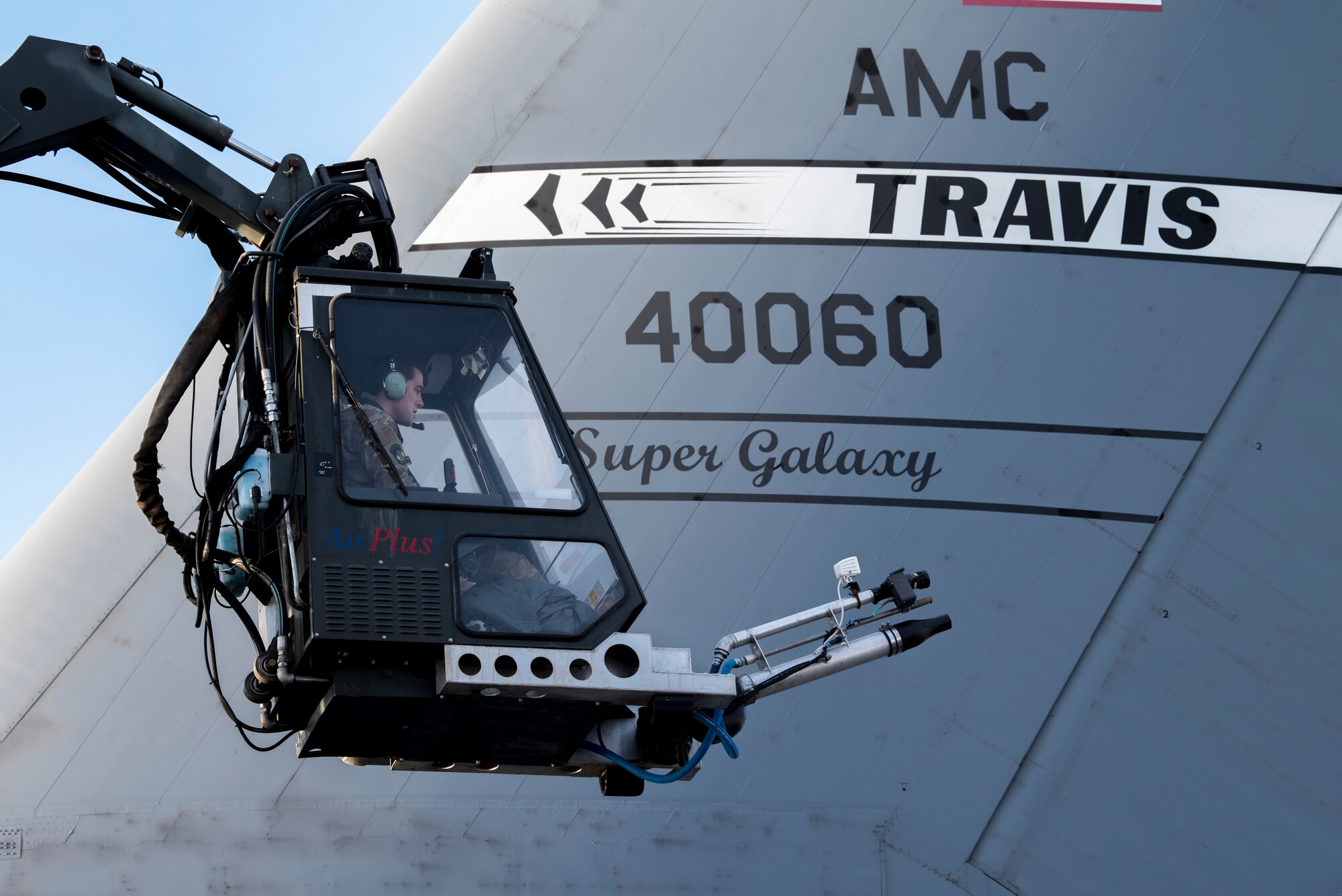 U.S. Air Force Staff Sgt. Damien Sloan, 821st Contingency Response Squadron, contingency response maintenance craftsman assigned to Travis Air Force Base, Calif., operates de-icing equipment on a C-5M Super Galaxy assigned to Travis during cold weather aircraft maintenance procedures training at Joint Base Elmendorf-Richardson, Alaska, Nov. 20, 2019. The training prepared Airmen to operate in arctic environments.