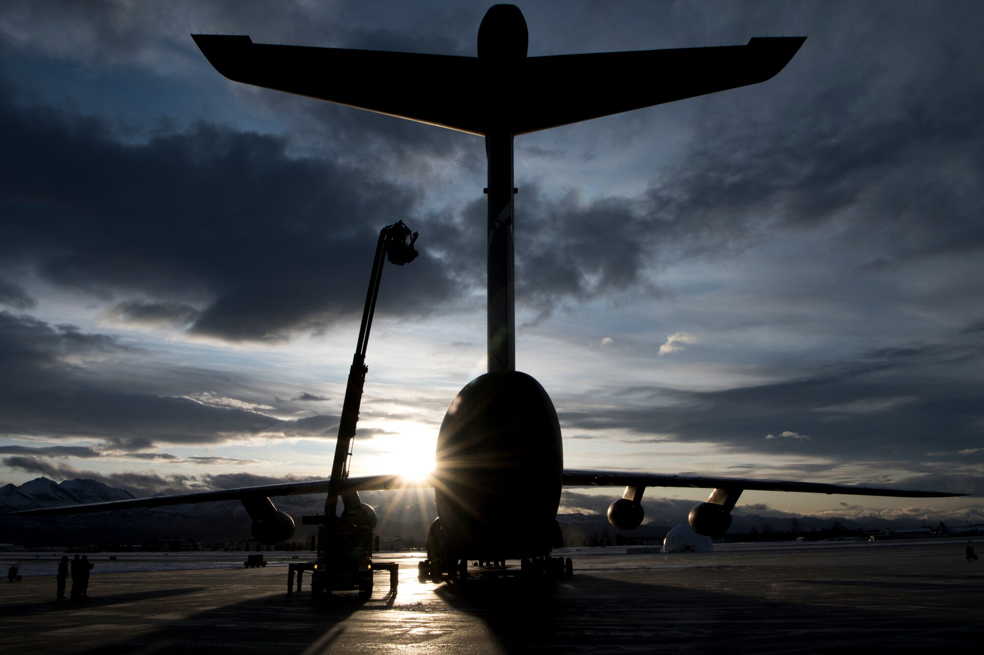 U.S. Air Force Staff Sgt. Damien Sloan, 821st Contingency Response Squadron, contingency response maintenance craftsman assigned to Travis Air Force Base, Calif., operates de-icing equipment on a C-5M Super Galaxy assigned to Travis during cold weather aircraft maintenance procedures training at Joint Base Elmendorf-Richardson, Alaska, Nov. 20, 2019. The training prepared Airmen to operate in arctic environments.