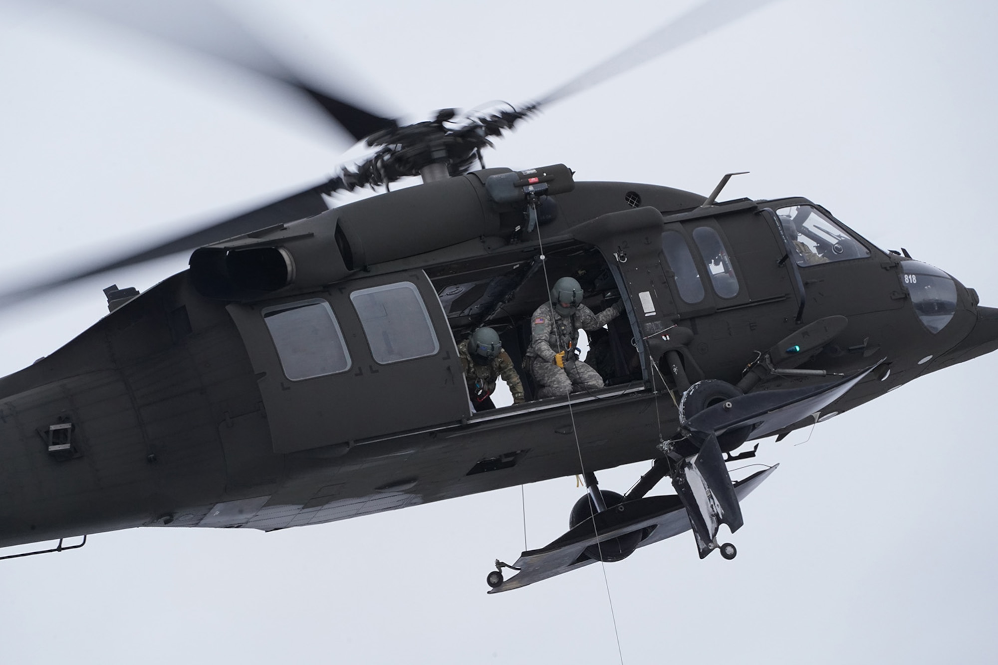 Alaska Army National Guard aviators hoist a simulated casualty with a UH-60 Black Hawk helicopter on Neibhur Drop Zone, Nov. 26, 2019, while assisting Soldiers from the 6th Brigade Engineer Battalion (Airborne), 4th Infantry Brigade Combat Team (Airborne), 25th Infantry Division, U.S. Army Alaska, honing their life-saving and Medevac hoist skills for the paratroopers’ upcoming rotation to the Joint Readiness Training Center at Fort Polk, La.