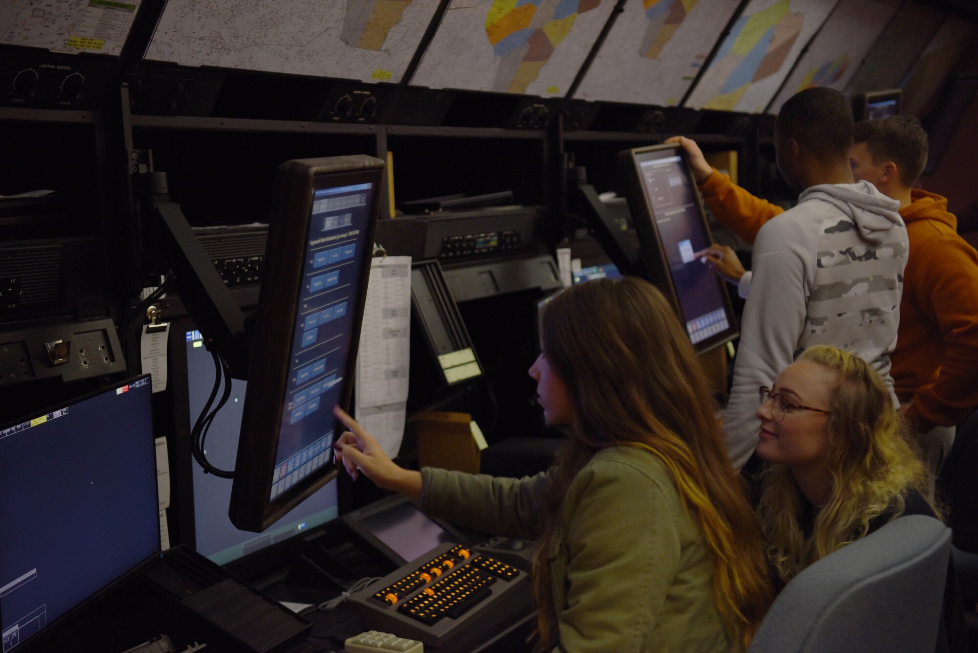 Instructor pilots, RAPCON and tower controllers from Columbus Air Force Base interacting with monitors in a training room Nov. 22, 2019, at the Memphis Center, Tenn. Columbus AFB is one of the busiest bases for Air Traffic Controllers with the average upgrade training time for Tower trainees being ten months and for RAPCON trainees is one year. (U.S. Air Force photo by Airmen 1st Class Jake Jacobsen)