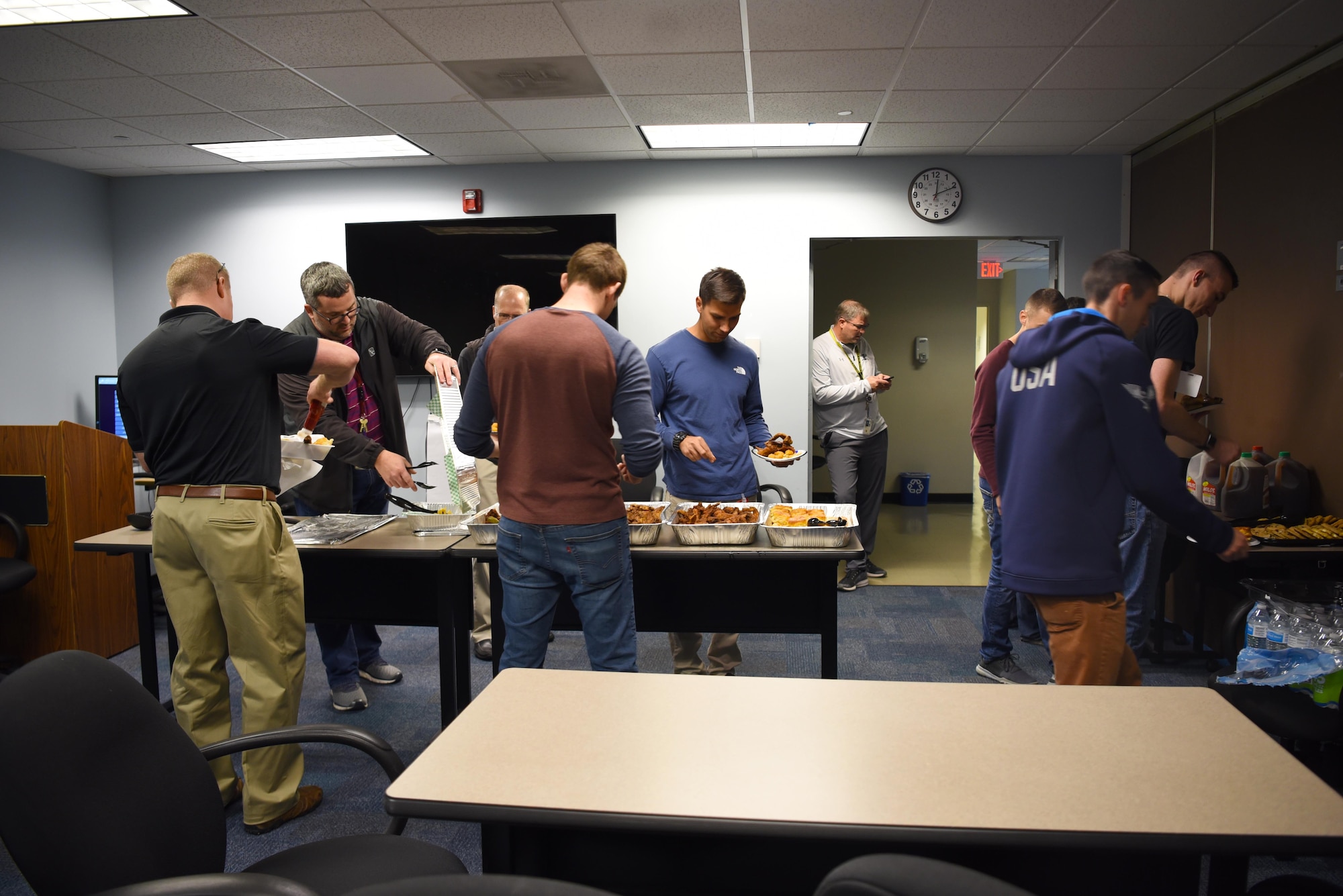 Instructor pilots, RAPCON and tower controllers from Columbus Air Force Base eating a catered lunch Nov. 22, 2019, at the Memphis Center, Tenn. All trainees and certified controllers must pass monthly proficiency tests that include items directed from the FAA and Headquarters Air Education and Training Command. (U.S. Air Force photo by Airmen 1st Class Jake Jacobsen)