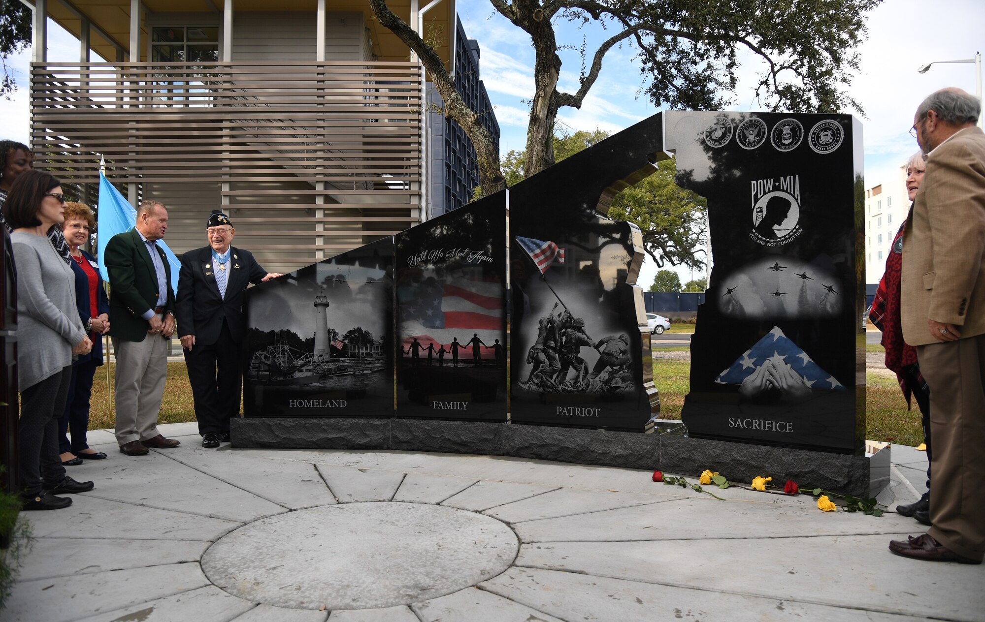 The 58th Gold Star Families Memorial Monument is unveiled during a dedication ceremony at Guice Veterans Memorial Park in Biloxi, Mississippi, Nov. 23, 2019. The monument honors families of service men and women who sacrificed their lives while serving in the military. (U.S. Air Force photo by Kemberly Groue)