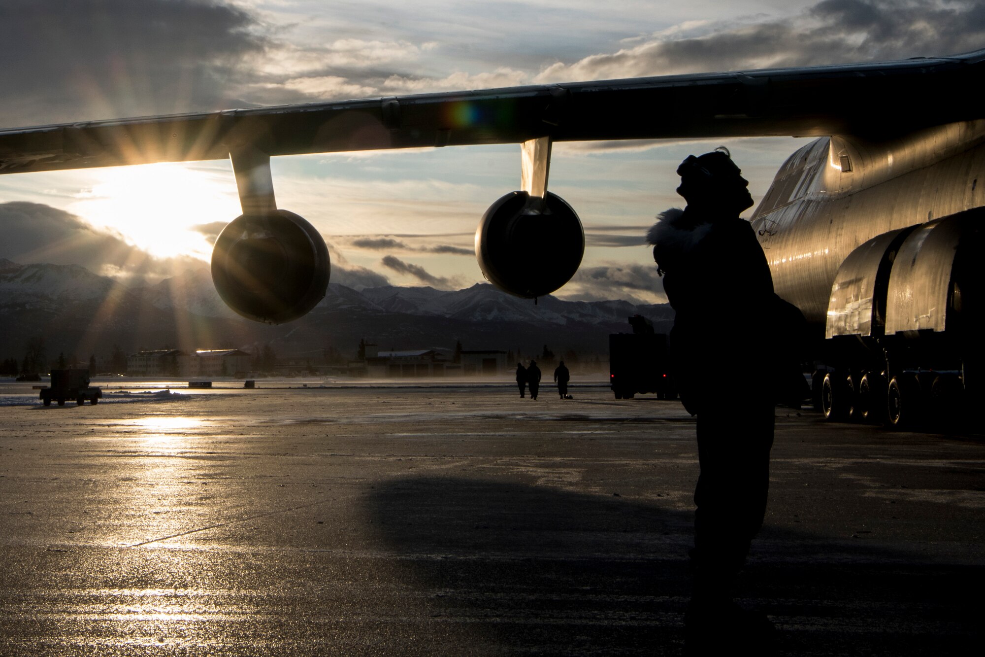 U.S. Air Force Staff Sgt. Damien Sloan, 821st Contingency Response Squadron, contingency response maintenance craftsman assigned to Travis Air Force Base, Calif., conducts de-icing training on a C-5M Super Galaxy assigned to Travis during cold weather aircraft maintenance procedures training at Joint Base Elmendorf-Richardson, Alaska, Nov. 20, 2019. The training prepared Airmen to operate in arctic environments.