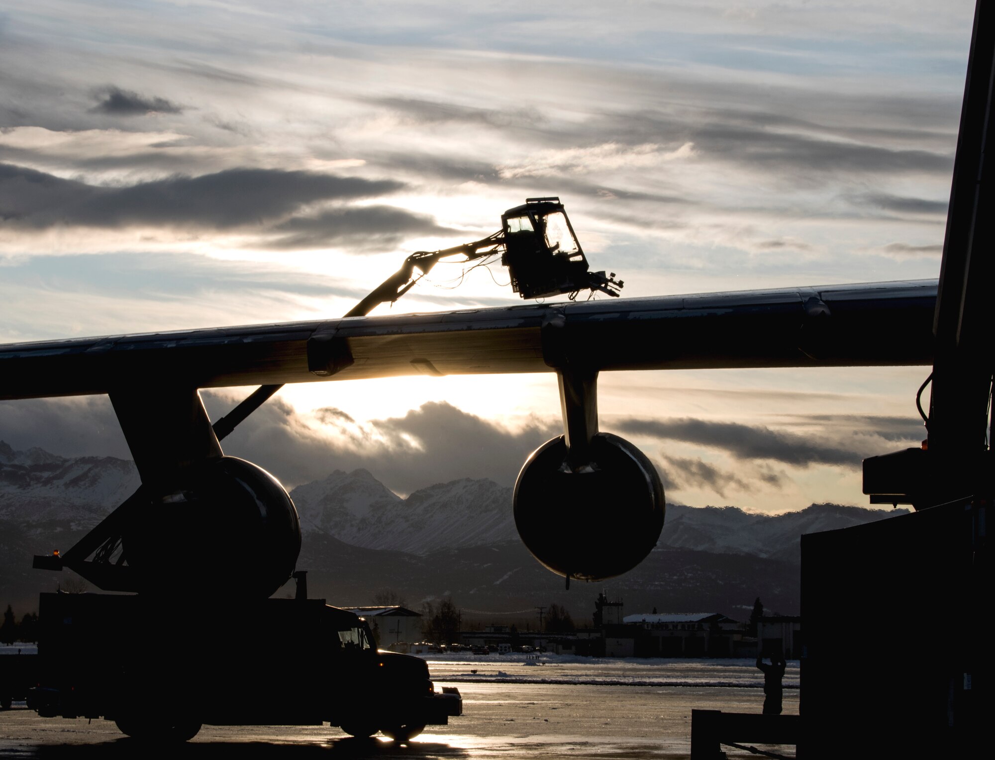 U.S. Air Force Staff Sgt. Damien Sloan, 821st Contingency Response Squadron, contingency response maintenance craftsman assigned to Travis Air Force Base, Calif., operates de-icing equipment on a C-5M Super Galaxy assigned to Travis during cold weather aircraft maintenance procedures training at Joint Base Elmendorf-Richardson, Alaska, Nov. 20, 2019. The training prepared Airmen to operate in arctic environments.