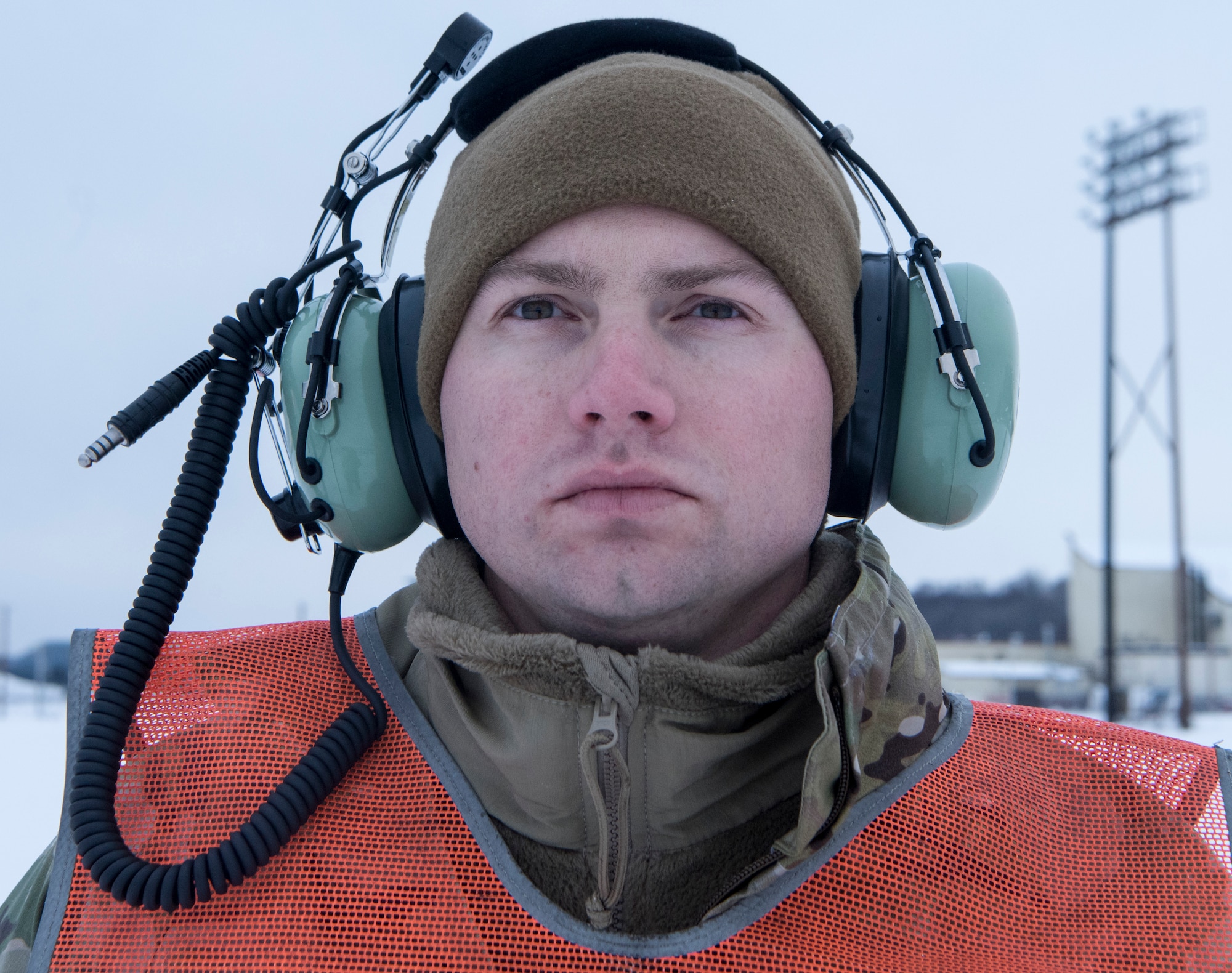 U.S. Air Force Staff Sgt. Joshua Sink, 921st Contingency Response Squadron, contingency response aircraft maintenance craftsman assigned to Travis Air Force Base, Calif., marshals a C-17 Globemaster III assigned to Travis AFB during cold weather aircraft maintenance procedures training at Joint Base Elmendorf-Richardson, Alaska, Nov. 19, 2019. The training prepared Airmen to operate in arctic environments.