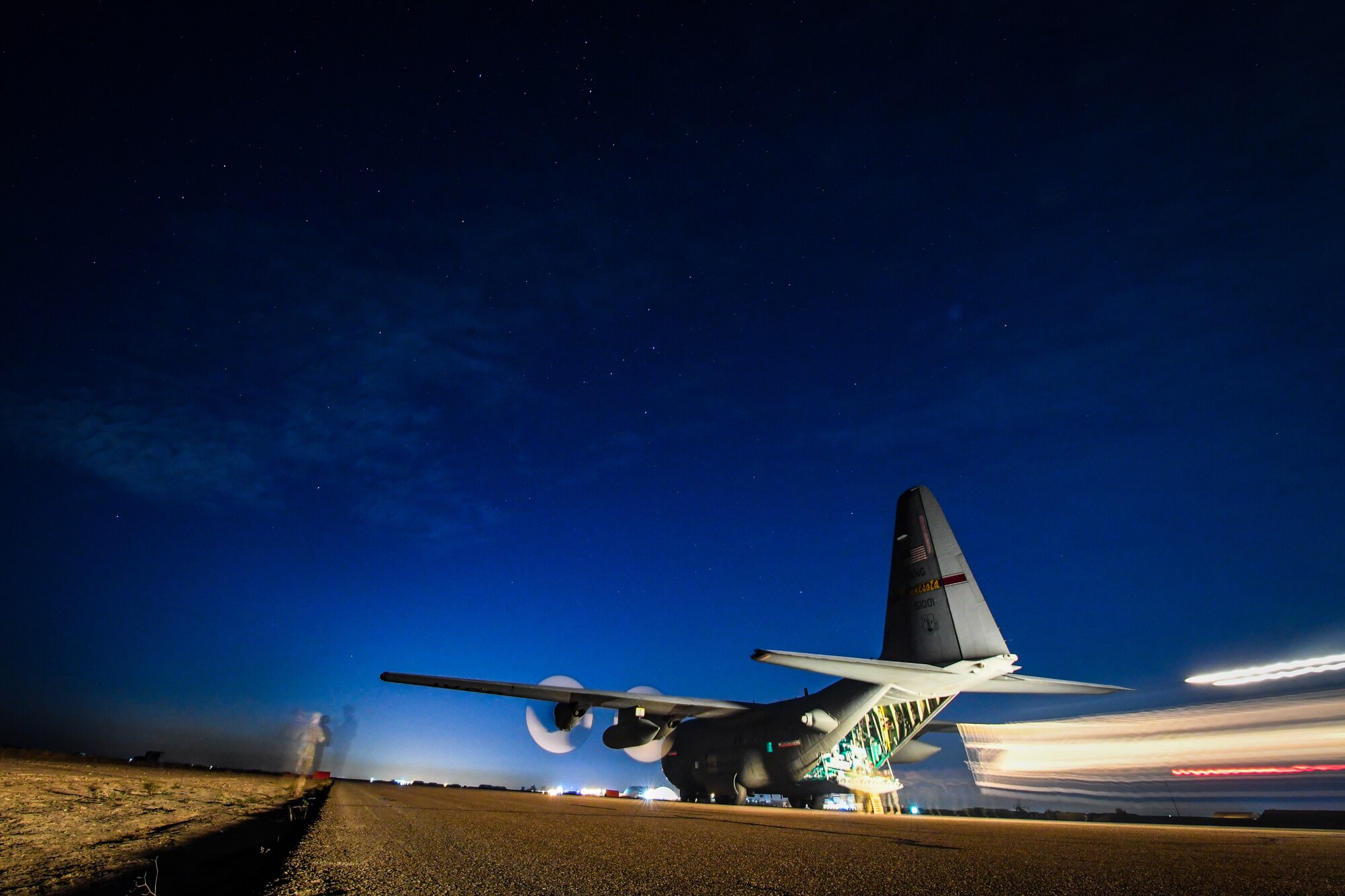 C-130 transports cargo between Kuwait and Iraq.