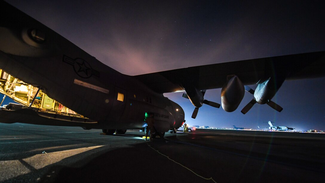 C-130 transports cargo between Kuwait and Iraq.