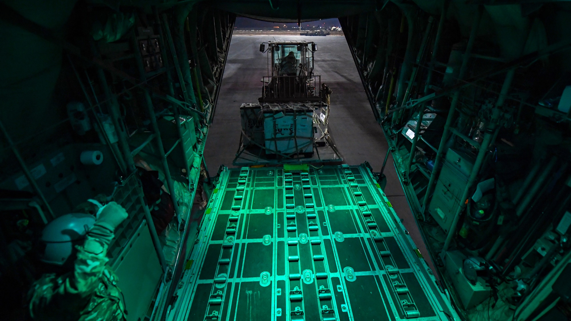C-130 transports cargo between Kuwait and Iraq.