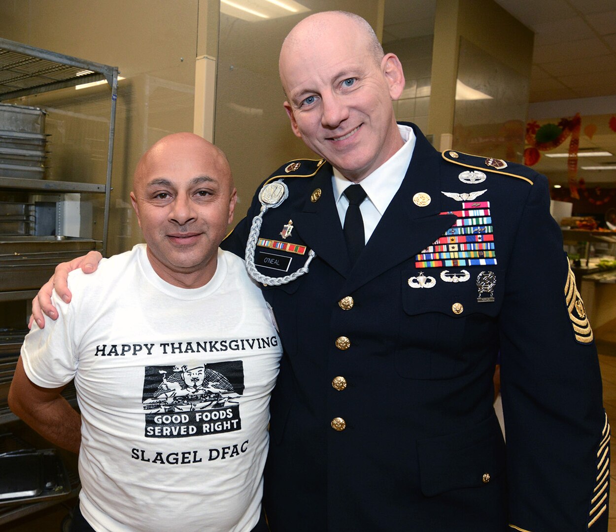 Maj. Gen. Patrick D. Sargent and Command Sgt. Maj. Buck O'Neal, along with other U.S. Army Medical Center of Excellence leaders, served Thanksgiving luncheon to Soldiers at the Slagel Dinning Facility at Joint Base San Antonio-Fort Sam Houston Nov. 28. The time-honored military tradition of senior leaders serving Thanksgiving Day dinner to Soldiers is an example of how military service is like an extended family. For many, this is their first time away from home and their first holiday away from home.