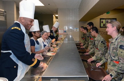 Maj. Gen. Patrick D. Sargent and Command Sgt. Maj. Buck O'Neal, along with other U.S. Army Medical Center of Excellence leaders, served Thanksgiving luncheon to Soldiers at the Slagel Dinning Facility at Joint Base San Antonio-Fort Sam Houston Nov. 28. The time-honored military tradition of senior leaders serving Thanksgiving Day dinner to Soldiers is an example of how military service is like an extended family. For many, this is their first time away from home and their first holiday away from home.