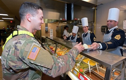 Maj. Gen. Patrick D. Sargent and Command Sgt. Maj. Buck O'Neal, along with other U.S. Army Medical Center of Excellence leaders, served Thanksgiving luncheon to Soldiers at the Slagel Dinning Facility at Joint Base San Antonio-Fort Sam Houston Nov. 28. The time-honored military tradition of senior leaders serving Thanksgiving Day dinner to Soldiers is an example of how military service is like an extended family. For many, this is their first time away from home and their first holiday away from home.