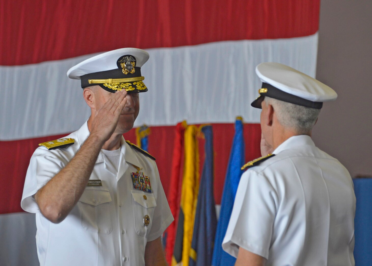 SOUTH CHINA SEA (Sept. 29, 2019) Rear Adm. George M. Wikoff relieves Rear Adm. Karl O. Thomas as commander, Task Force 70 during a change of command ceremony in the hangar bay aboard the aircraft carrier USS Ronald Reagan (CVN 76). CTF 70 is forward-deployed to the U.S. 7th Fleet area of operations in support of security and stability in the Indo-Pacific region.