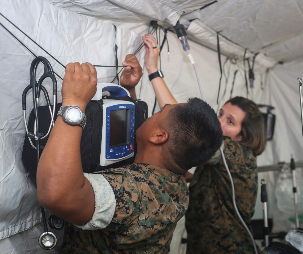 U.S. Navy Sailors with Special Purpose Marine Air-Ground Task Force-Crisis Response-Africa 20.1, Marine Forces Europe and Africa, set up a shock trauma platoon in preparation of SPMAGTF-CR-AF 20.1 at Naval Air Station Sigonella, Italy Sept. 26, 2019. SPMAGTF-CR-AF is deployed to conduct crisis-response and theater-security operations in Africa and promote regional stability by conducting military-to-military training exercises throughout Europe and Africa. (U.S. Marine Corps photo by Lance Cpl. Nello Miele)