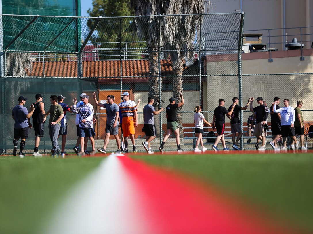 U.S. Marines with Special Purpose Marine Air - Ground Task Force - Crisis Response - Africa 20.1, Marine Forces Europe and Africa, and U.S. Navy Sailors compete in a softball tournament coordinated by the Sigonella Softball Association at Naval Air Station Sigonella, Italy, Sept. 28, 2019