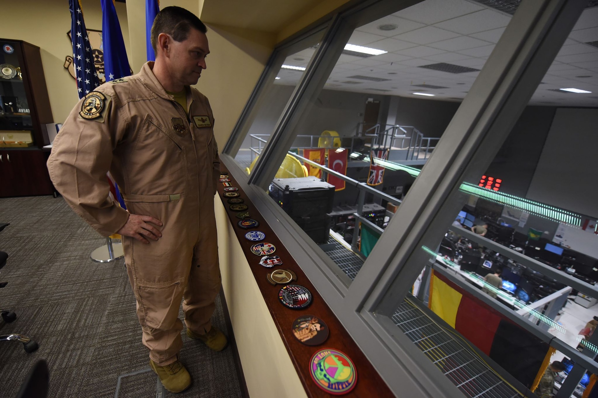 Maj. Gen. Saltzman looks down at the COD floor.