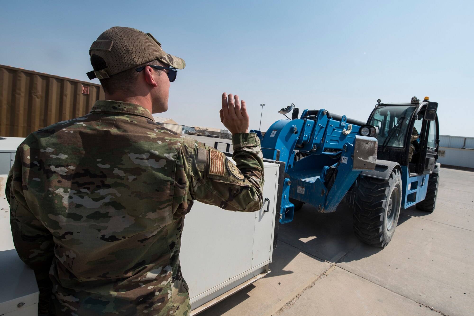 Senior Airman Patrick Lonski and Master Sgt. Brian Encarnacion, 386th Expeditionary Civil Engineer Squadron material control journeyman and NCO-in-charge (respectively), move heating, ventilation and air-conditioning units at Ali Al Salem Air Base, Kuwait, Sept. 6, 2019. These specialists ensure every asset--from paper clips to multimillion-dollar machinery--is accounted for. (U.S. Air Force photo by Senior Airman Lane T. Plummer)