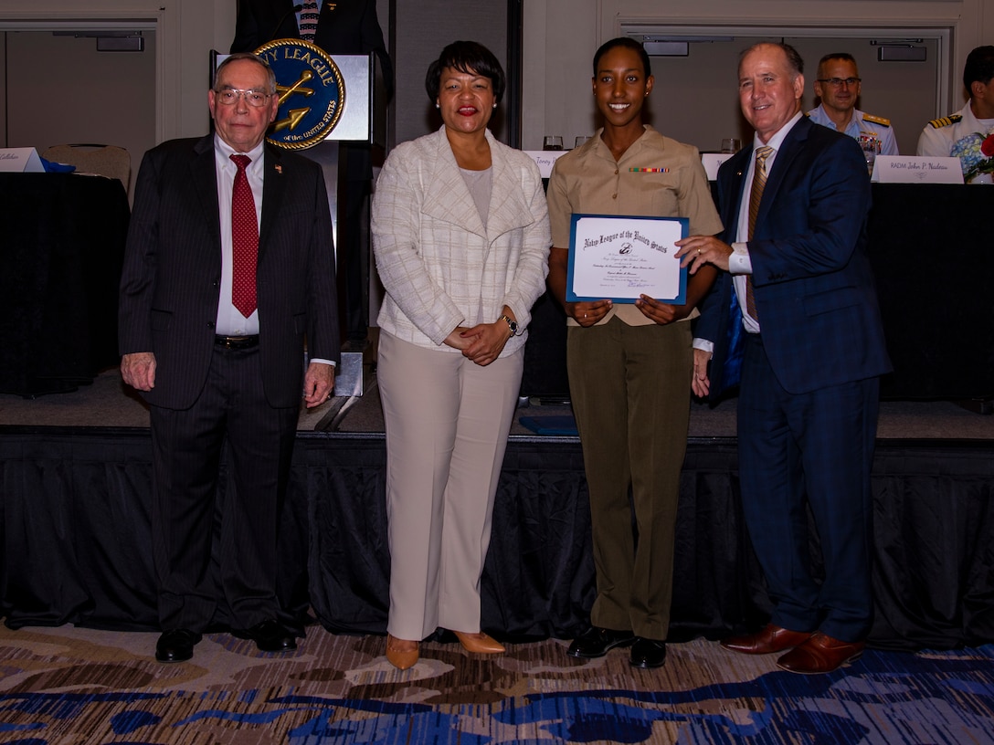 U.S. Marine Corps Cpl. Mahlet M. Herrmann, a manpower clerk with 4th Marine Division, receives an award during the Navy League Military Appreciation Luncheon, New Orleans, Sept. 27, 2019. The Navy League awarded Herrmann for being the most outstanding noncommissioned officer of 4th MARDIV. (U.S. Marine Corps photo by Lance Cpl. Jose Gonzalez)