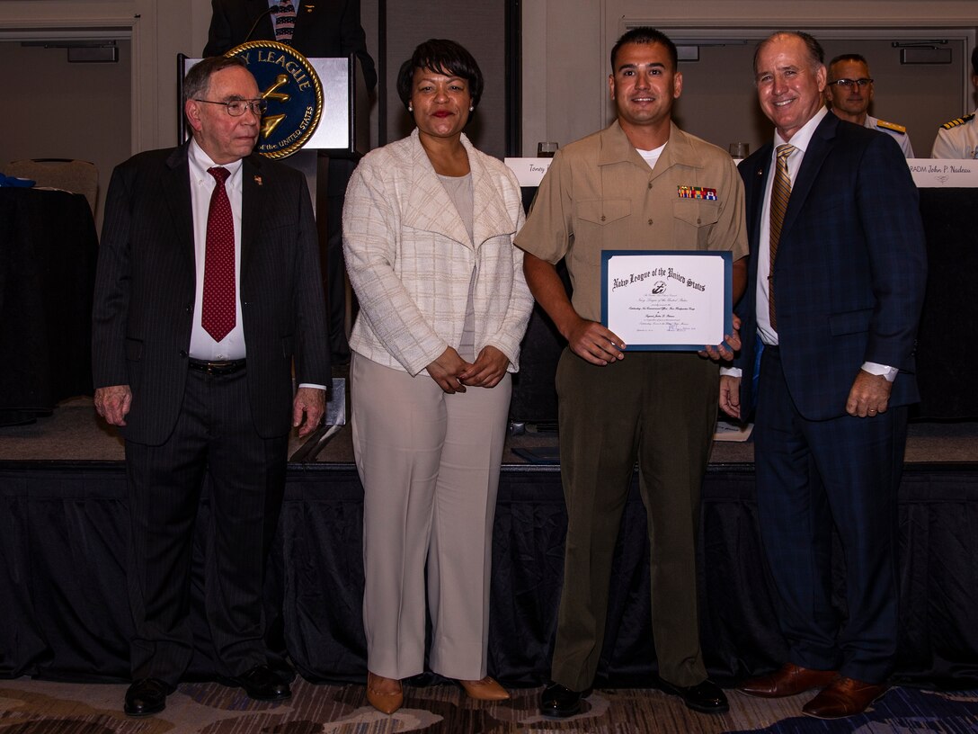 U.S. Marine Corps Sgt. Justin D. Peterson, a training and readiness noncommissioned officer with Force Headquarters Group, receives an award during the Navy League Military Appreciation Luncheon, New Orleans, Sept. 27, 2019. The Navy League awarded Peterson for being the most outstanding NCO of FHG. (U.S. Marine Corps photo by Lance Cpl. Jose Gonzalez)