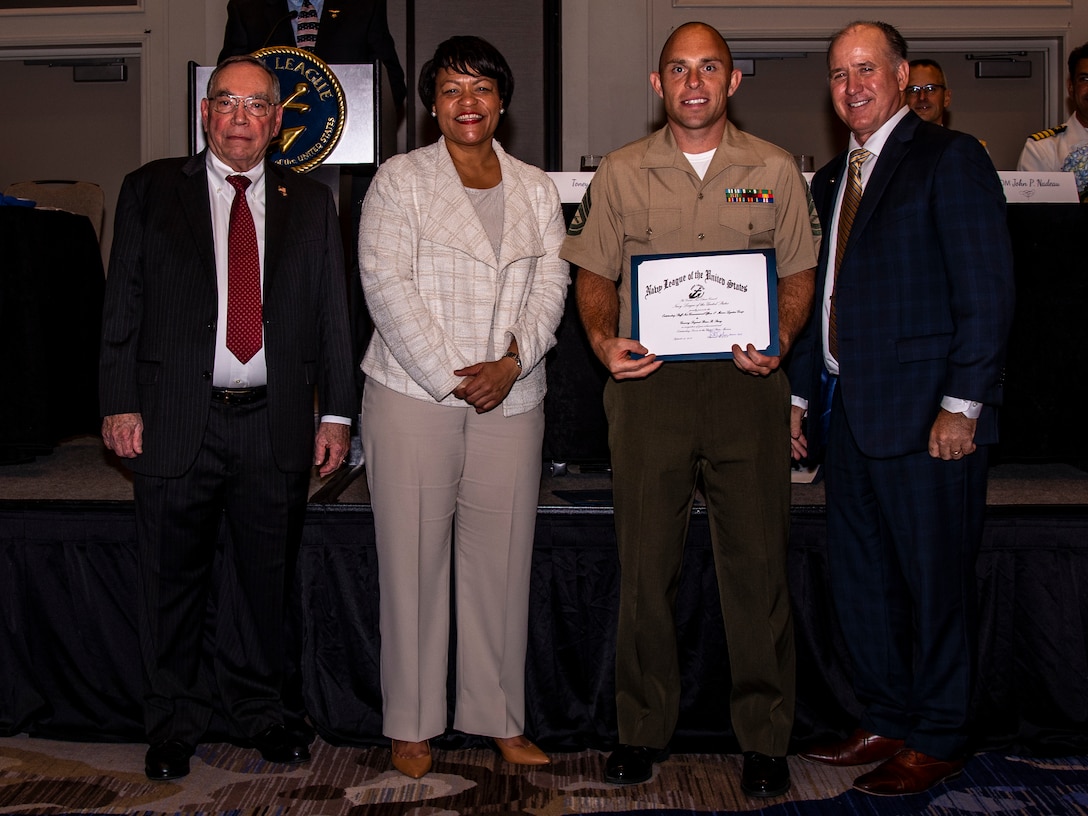 U.S. Marine Corps Gunnery Sgt. Brian R. Stacey, an administrative chief with 4th Marine Logistics Group, receives an award during the Navy League Military Appreciation Luncheon, New Orleans, Sept. 27, 2019. The Navy League awarded Stacey for being the most outstanding staff noncommissioned officer of 4th MLG. (U.S. Marine Corps photo by Lance Cpl. Jose Gonzalez)