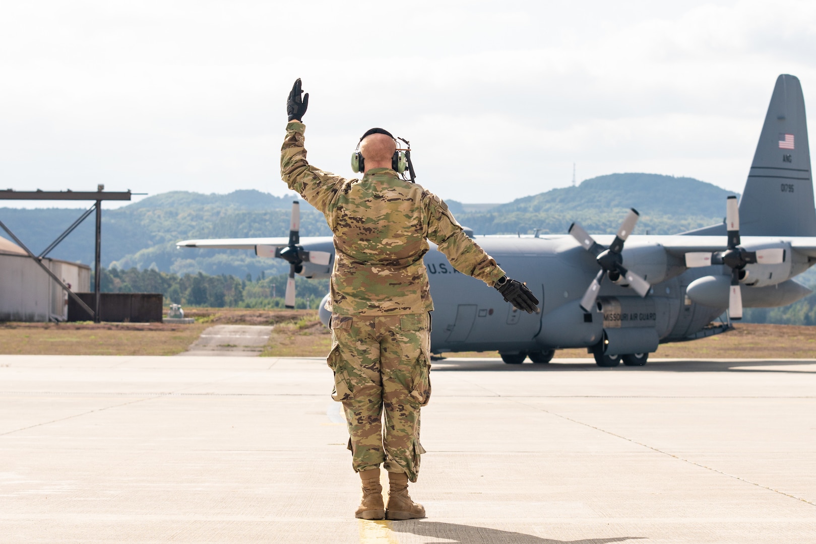 U.S. Air Force Tech. Sgt. Jonathan Jones, with the 139th Airlift Wing, Missouri Air National Guard, marshals in a C-130H Hercules aircraft during Saber Junction 19 at Ramstein Air Base, Germany, Sep. 17, 2019. SJ19 is an exercise involving 16 allies and partner nations at the U.S. Army’s Grafenwoehr and Hohenfels Training Areas, Sept. 3-30.