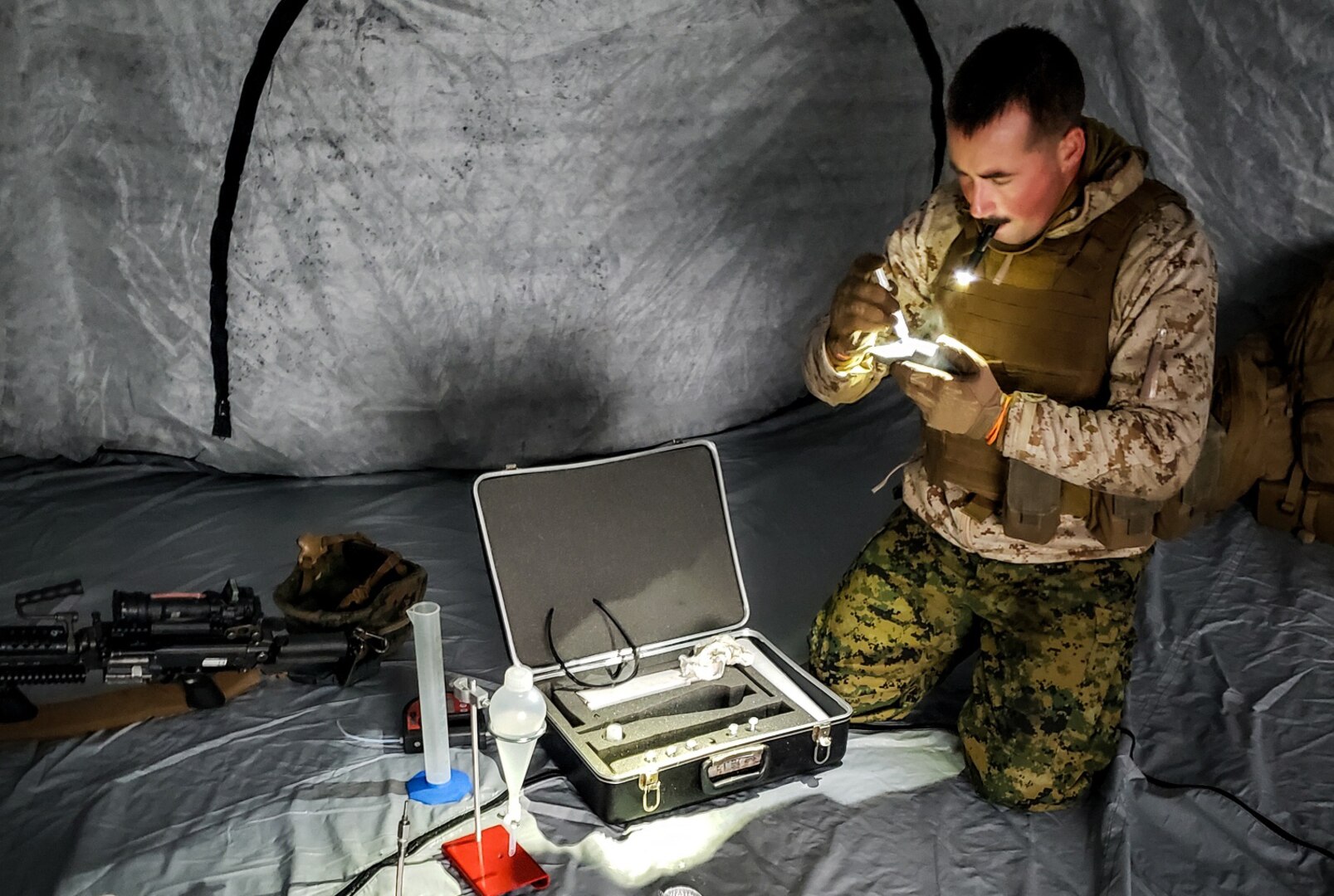 A Marine conducts tests to ensure fuel meets military specifications