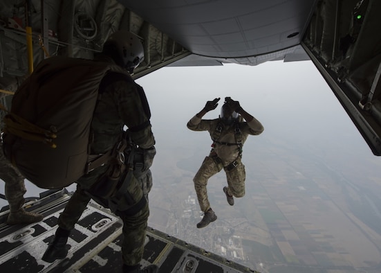 A U.S. military jumpmaster models an aircraft exit for a student from the Bulgarian 68th Special Forces Brigade during a military free-fall course in Plovdiv, Bulgaria, Sept. 24, 2019. The military free-fall course was a central focus for Thracian Fall and the 37th Airlift Squadron provided primary aircraft support using their C-130J Super Hercules. (U.S. Air Force photo by Staff Sgt. Kirsten Brandes)