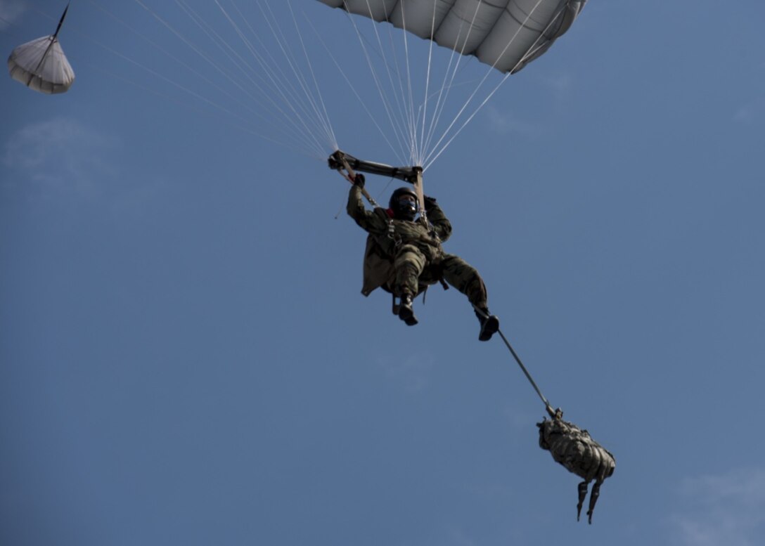 A jumper assigned to Bulgaria’s 68th Special Forces Brigade parachutes into Cheshnegirovo drop zone in Plovdiv, Bulgaria, Sept. 26, 2019. Bulgarian 68th SFB members who complete the military free-fall course are expected to complete jumps with bags full of gear as well as rifles. (U.S. Air Force photo by Staff Sgt. Kirsten Brandes)