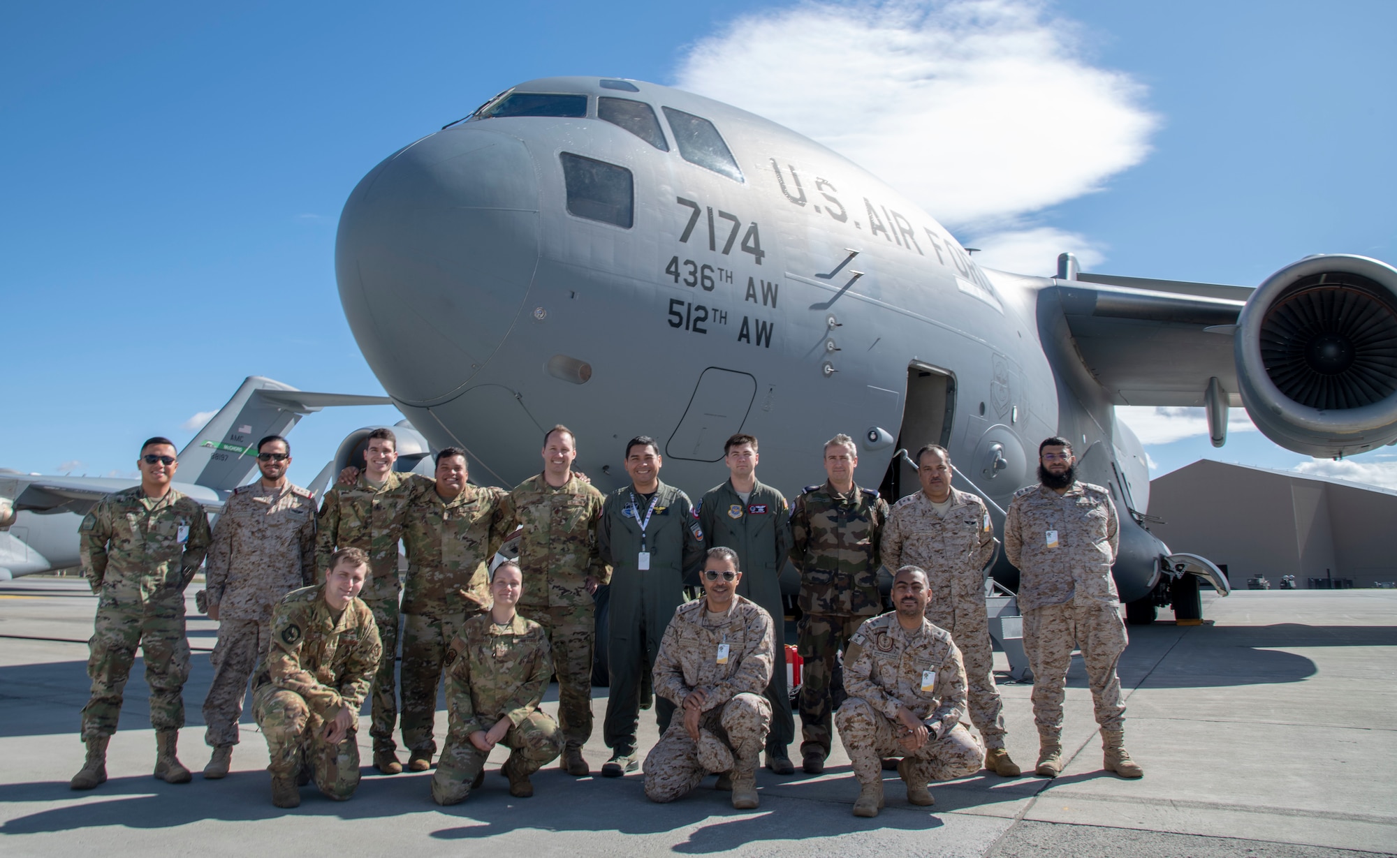 Airmen from the 3rd Airlift Squadron pose for a photo with other exercise participants Sept. 24, 2019, at Fairchild Air Force Base, Wash., during Mobility Guardian 2019. Exercise Mobility Guardian is Air Mobility Command's premier, large-scale mobility exercise. Through robust and relevant training, Mobility Guardian improves the readiness and capabilities of Mobility Airmen to deliver rapid global mobility and builds a more lethal and ready Air Force.(U.S. Air Force video by Tech. Sgt. Esteban Esquivel).
